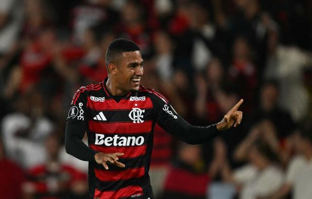 (FILES) Flamengo's forward #16 Samuel Lino celebrates a goal later disallowed after a VAR review for offside during the Copa Libertadores semifinal first leg football match between Brazil's Flamengo and Argentina's Racing at the Maracana stadium in Rio de Janeiro, Brazil on October 22, 2025. Samuel Lino's transfer from Atletico Madrid to Flamengo amounted to the equivalent of 31.6 million Euros, according to the club's balance sheet consulted by AFP on November 3, 2025, a record as the highest transfer fee ever paid by a South American football team. (Photo by Mauro PIMENTEL / AFP)