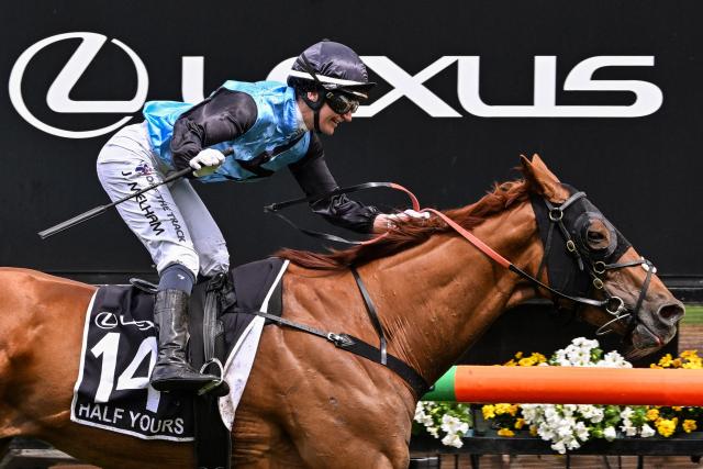 Half Yours ridden by Australian jockey Jamie Melham wins the Melbourne Cup horse race at the Flemington Racecourse in Melbourne on November 4, 2025. (Photo by WILLIAM WEST / AFP)