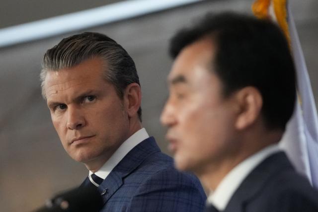 US Defense Secretary Pete Hegseth (L) listens as South Korean Defense Minister Ahn Gyu-back (R) speaks during a joint press conference following the 57th Security Consultative Meeting (SCM) at the Defense Ministry in Seoul on November 4, 2025. (Photo by Lee Jin-man / POOL / AFP)