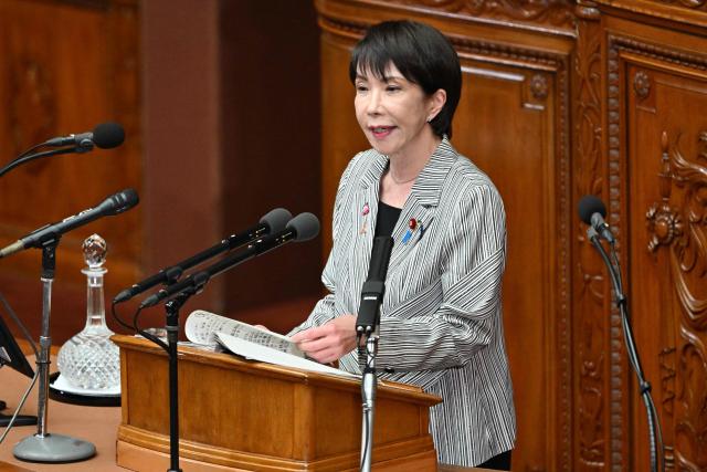 Japan's Prime Minister Sanae Takaichi answers questions from Yoshihiko Noda, leader of the main opposition Constitutional Democratic Party of Japan (CDP), regarding her policy speech at the House of Representatives of the National Diet in Tokyo on November 4, 2025. (Photo by Kazuhiro NOGI / AFP)