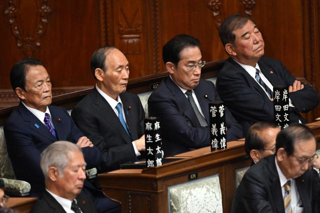 (L-R) Former Japan's prime ministers, Taro Aso, Yoshihide Suga, Fumio Kishida, and Shigeru Ishiba attend a session at the House of Representatives of the National Diet in Tokyo on November 4, 2025. (Photo by Kazuhiro NOGI / AFP)