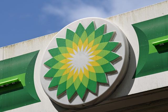 (FILES) BP logos are pictured at a BP petrol and diesel filling station in north London on May 12, 2021. British energy group BP on November 4, 2025, reported a sharp rise in net profit for the third quarter, as it presses on with its turnaround plan, offsetting falling oil prices. Profit after tax jumped to $1.16 billion for the July-September period, compared with $206 million in the third quarter of 2024, BP said in an earnings statement. (Photo by Glyn KIRK / AFP)