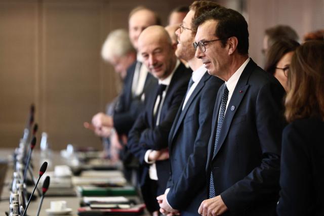 France's Labour Minister Jean-Pierre Farandou (R) arrives to attend the opening meeting of the Work and Pensions Conference at the Labour ministry in Paris, on November 4, 2025. (Photo by Thibaud MORITZ / AFP)