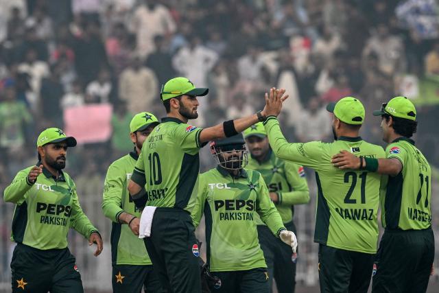 Pakistan's captain Shaheen Shah Afridi (C) celebrate with teammates after the dismissal of South Africa's Lhuan-dre Pretorius during the first one-day international (ODI) cricket match between Pakistan and South Africa at the Iqbal Stadium in Faisalabad on November 4, 2025. (Photo by Aamir QURESHI / AFP)