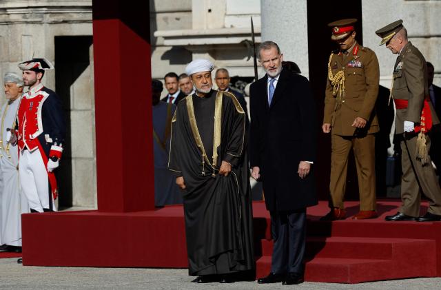 Spain's King Felipe VI (R) and Sultan of Oman Haitham bin Tariq (L) attend a welcoming ceremony with military honors on the first day of a two-day State Visit to Spain at the Royal Palace in Madrid on November 4, 2025. (Photo by Oscar DEL POZO / AFP)
