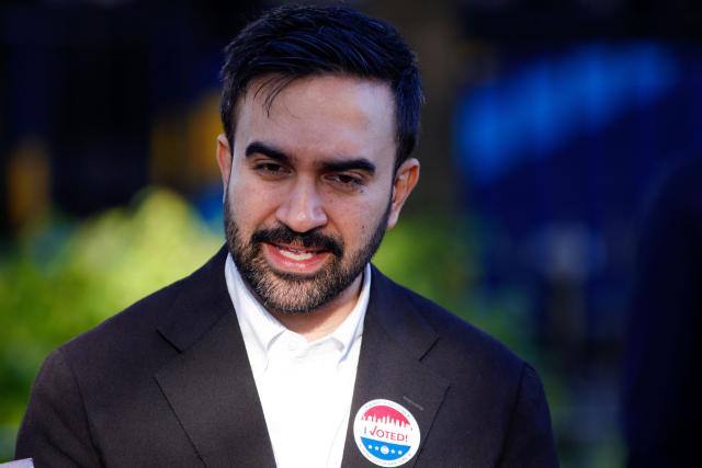 Democratic New York City mayoral candidate Zohran Mamdani speaks to the press after voting at a polling location at Frank Sinatra School of Arts in the Queens borough of New York City on November 4, 2025. New Yorkers will pick a new mayor on November 4 after an unpredictable race that has drawn attention from far beyond the largest city in the United States, with President Donald Trump branding frontrunner Zohran Mamdani "a communist." Breakout Democratic Party candidate Mamdani, a naturalized Muslim American who represents Queens in the state legislature, leads former governor and sex assault-accused Andrew Cuomo, running as an independent after losing his party's primary contest to Mamdani. (Photo by Leonardo Munoz / AFP)