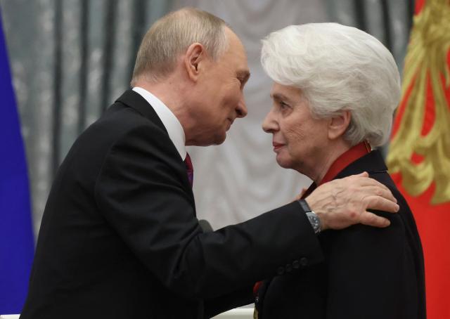 Russian President Vladimir Putin awards head of the Solzhenitsyn Foundation Natalia Solzhenitsyna with the Order For Merit to the Fatherland 3rd class during an awards ceremony marking the National Unity Day at the Kremlin in Moscow on November 4, 2025. (Photo by MAXIM SHIPENKOV / POOL / AFP)