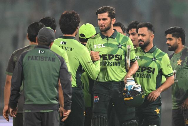 Pakistan's captain Shaheen Shah Afridi (C) celebrates with teammates at the end of the first one-day international (ODI) cricket match between Pakistan and South Africa at the Iqbal Stadium in Faisalabad on November 4, 2025. (Photo by Aamir QURESHI / AFP)
