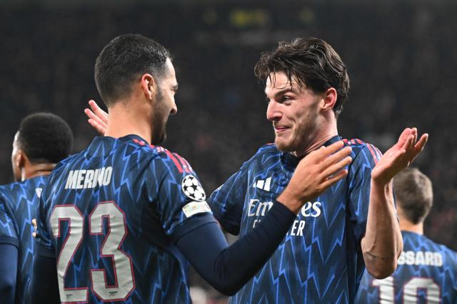 Arsenal's Spanish midfielder #23 Mikel Merino celebrates with team mates after scoring his team's 0:3 during the UEFA Champions League - league phase day 4 football match between Slavia Prague and Arsenal FC in Prague, Czech Republic on November 4, 2025. (Photo by Michal Cizek / AFP)