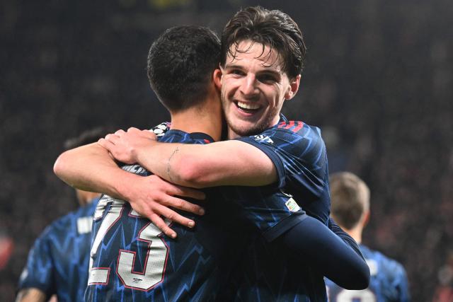 Arsenal's Spanish midfielder #23 Mikel Merino celebrates with team mates after scoring his team's 0:3 during the UEFA Champions League - league phase day 4 football match between Slavia Prague and Arsenal FC in Prague, Czech Republic on November 4, 2025. (Photo by Michal Cizek / AFP)