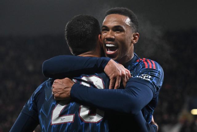 Arsenal's Spanish midfielder #23 Mikel Merino celebrates with Arsenal's Brazilian defender #06 Gabriel Magalhaes after scoring his team's 0:3 during the UEFA Champions League - league phase day 4 football match between Slavia Prague and Arsenal FC in Prague, Czech Republic on November 4, 2025. (Photo by Michal Cizek / AFP)