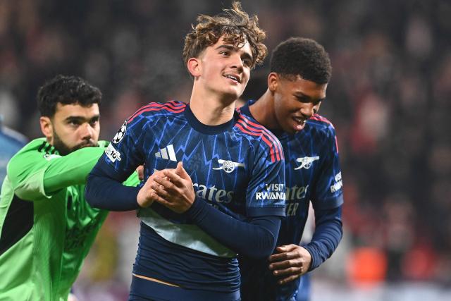 Arsenal's Spanish goalkeeper #01 David Raya, Arsenal's Brazilian defender #06 Gabriel Magalhaes and Arsenal's English midfielder #56 Max Dowman celebrate after the UEFA Champions League - league phase day 4 football match between Slavia Prague and Arsenal FC in Prague, Czech Republic on November 4, 2025. (Photo by Michal Cizek / AFP)