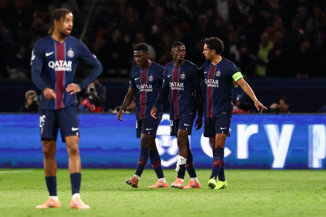 Paris Saint-Germain's French forward #10 Ousmane Dembele (C) speaks with teammates after scoring a goal which was ruled out by the VAR during the UEFA Champions League, league phase day 4, football match between Paris Saint-Germain (PSG) and FC Bayern Munich at the Parc des Princes in Paris, on November 4, 2025. (Photo by FRANCK FIFE / AFP)