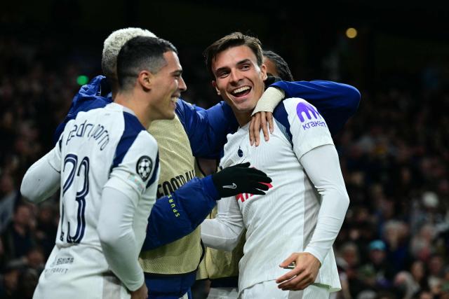 Tottenham Hotspur's Portugese midfielder #06 Joao Palhinha (R) celebrates with teammates after scoring their fourth goal during the UEFA Champions League, league phase football match between Tottenham Hotspur and FC Copenhagen at the Tottenham Hotspur Stadium in London, on November 4, 2025. (Photo by Ben STANSALL / AFP)