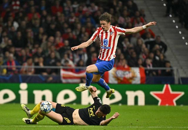 Atletico Madrid's English midfielder #04 Conor Gallagher jumps next to Union St-Gilloise's English defender #26 Ross Sykes during the UEFA Champions League league phase day 4 football match between Club Atletico de Madrid and Union St-Gilloise at the Metropolitano Stadium in Madrid on November 4, 2025. (Photo by JAVIER SORIANO / AFP)