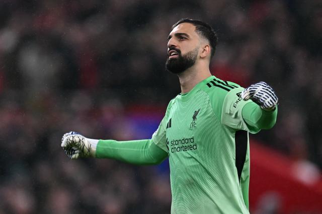 Liverpool's Georgian goalkeeper #25 Giorgi Mamardashvili celebrates on the final whistle in the UEFA Champions League, league phase football match between Liverpool and Real Madrid at Anfield in Liverpool, north west England on November 4, 2025. Liverpool won the game 1-0. (Photo by Paul ELLIS / AFP)