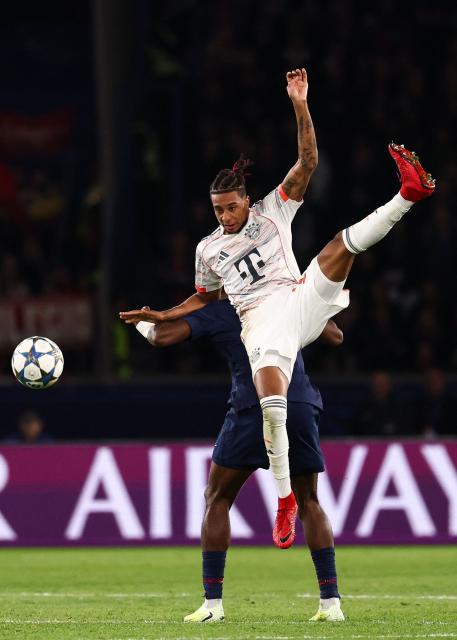 Bayern Munich's French midfielder #17 Michael Olise fights for the ball with Paris Saint-Germain's Portuguese defender #25 Nuno Mendes during the UEFA Champions League, league phase day 4, football match between Paris Saint-Germain (PSG) and FC Bayern Munich at the Parc des Princes in Paris, on November 4, 2025. (Photo by FRANCK FIFE / AFP)
