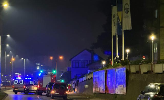 Emergency service personnel are dispatched to the scene of a blaze after fire broke out in a nursing home, in the North-Eastern Bosnian city of Tuzla, late on November 4, 2025. (Photo by -STR / AFP)