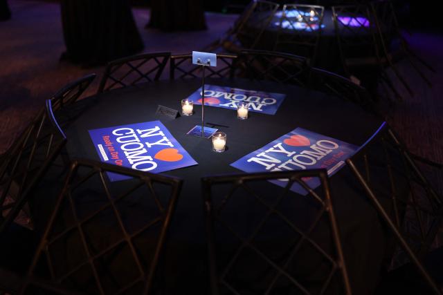 Signs are seen on a reserved table ahead of New York City Mayoral candidate Andrew Cuomo's election night event in New York on November 4, 2025. (Photo by CHARLY TRIBALLEAU / AFP)