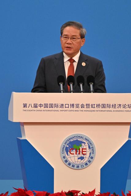 China's Premier Li Qiang speaks during the opening ceremony of the 8th China International Import Expo (CIIE) and the Hongqiao International Economic Forum in Shanghai on November 5, 2025. (Photo by Hector RETAMAL / AFP)