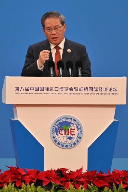 China's Premier Li Qiang speaks during the opening ceremony of the 8th China International Import Expo (CIIE) and the Hongqiao International Economic Forum in Shanghai on November 5, 2025. (Photo by Hector RETAMAL / AFP)