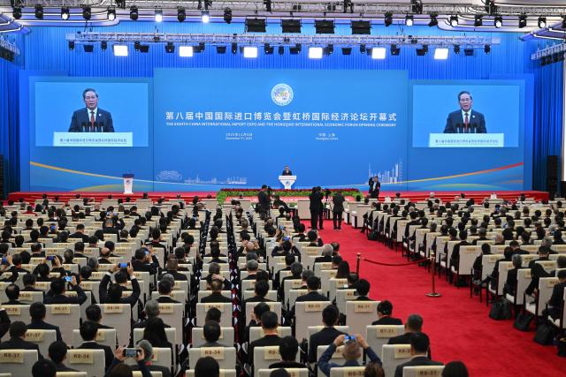 China's Premier Li Qiang speaks during the opening ceremony of the 8th China International Import Expo (CIIE) and the Hongqiao International Economic Forum in Shanghai on November 5, 2025. (Photo by Hector RETAMAL / AFP)