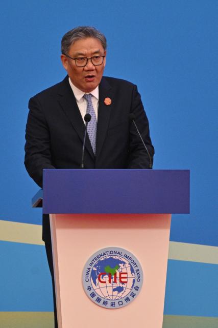 Chinese Commerce Minister Wang Wentao speaks during the opening ceremony of the 8th China International Import Expo (CIIE) and the Hongqiao International Economic Forum in Shanghai on November 5, 2025. (Photo by Hector RETAMAL / AFP)