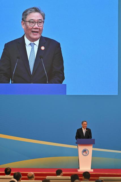 Chinese Commerce Minister Wang Wentao speaks during the opening ceremony of the 8th China International Import Expo (CIIE) and the Hongqiao International Economic Forum in Shanghai on November 5, 2025. (Photo by Hector RETAMAL / AFP)