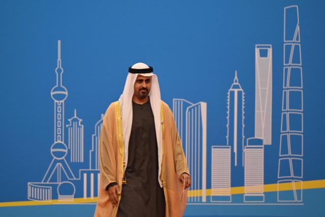 Deputy Chairman of the Presidential Court for Development and Fallen Heroes’ Affairs Theyab bin Mohamed bin Zayed leaves after speaking at the opening ceremony of the 8th China International Import Expo (CIIE) and the Hongqiao International Economic Forum in Shanghai on November 5, 2025. (Photo by Hector RETAMAL / AFP)