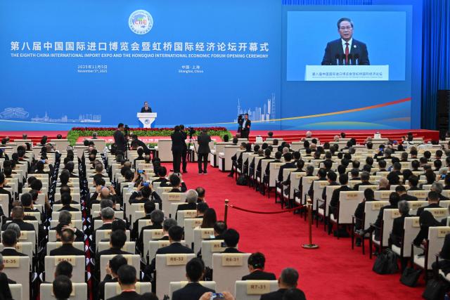 China's Premier Li Qiang speaks during the opening ceremony of the 8th China International Import Expo (CIIE) and the Hongqiao International Economic Forum in Shanghai on November 5, 2025. (Photo by Hector RETAMAL / AFP)