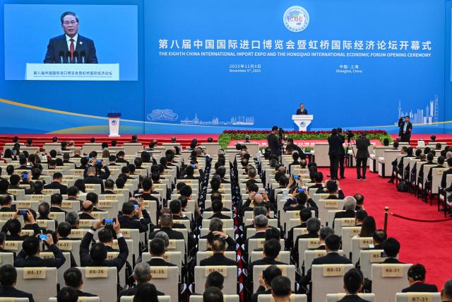 China's Premier Li Qiang speaks during the opening ceremony of the 8th China International Import Expo (CIIE) and the Hongqiao International Economic Forum in Shanghai on November 5, 2025. (Photo by Hector RETAMAL / AFP)