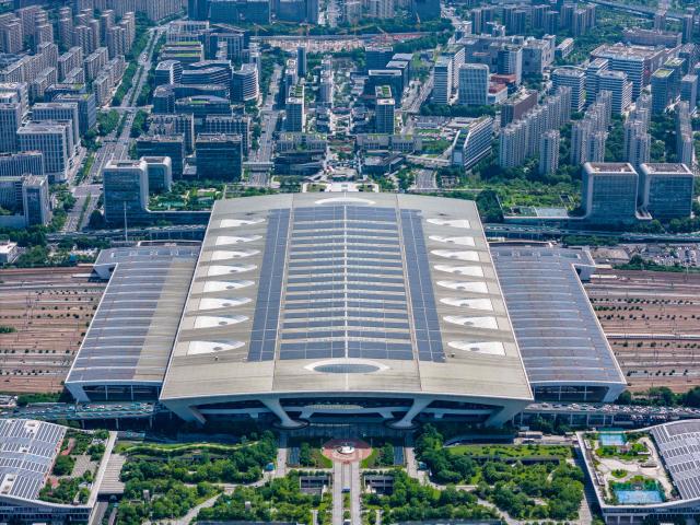 This aerial photo shows solar panels on the roof of a railway station in Hangzhou, eastern China's Zhejiang province on October 29, 2025. (Photo by AFP) / China OUT