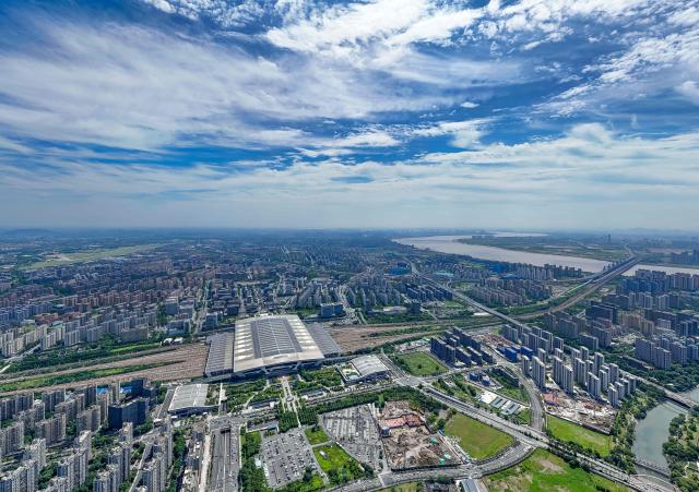 This aerial photo shows solar panels on the roof of a railway station in Hangzhou, eastern China's Zhejiang province on October 29, 2025. (Photo by AFP) / China OUT