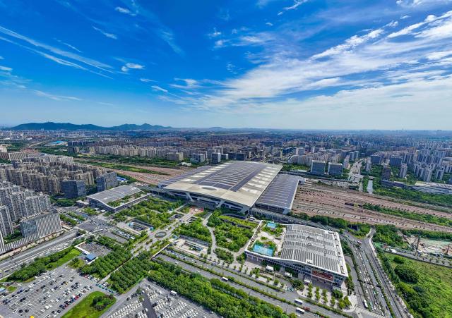 This aerial photo shows solar panels on the roof of a railway station in Hangzhou, eastern China's Zhejiang province on October 29, 2025. (Photo by AFP) / China OUT