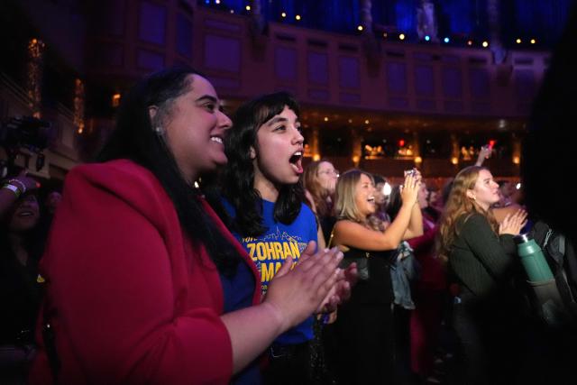 Supporters listen to New York City Mayoral candidate Zohran Mamdani speak during an election night event at the Brooklyn Paramount Theater in Brooklyn, New York on November 4, 2025. New Yorkers elected leftist Zohran Mamdani as their next mayor November 4, 2025 broadcasters projected, on a day of key local ballots across the country offering the first electoral judgement of Donald Trump's tumultuous second White House term. (Photo by Angelina Katsanis / AFP)