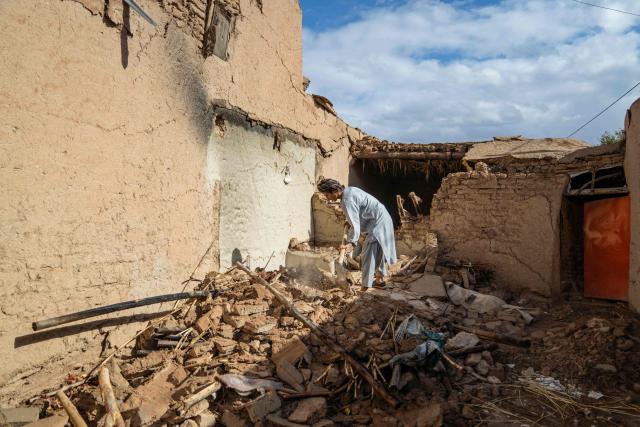 An Afghan man clears rubble from the courtyard of his damaged house, in the aftermath of an earthquake at a village in the Khulm district of Samangan province on November 4, 2025. An earthquake of 6.3-magnitude in northern Afghanistan has killed at least 27 people and injured nearly 1,000, the health ministry said on November 4, announcing the end of rescue operations. (Photo by AFP)