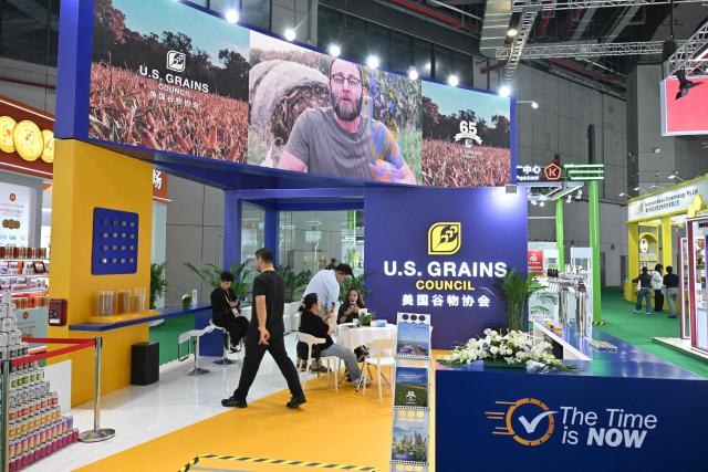 A view of the US Grains Council is seen during the 8th China International Import Expo (CIIE) in Shanghai on November 5, 2025. China said on November 5, it would extend a suspension of additional tariffs on US goods for one year, making official an agreement reached in talks between presidents Xi Jinping and Donald Trump last week. (Photo by Hector RETAMAL / AFP)