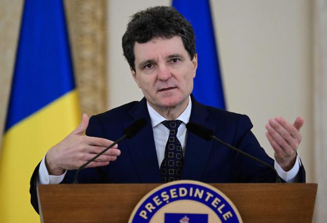 Romanian President Nicusor Dan addresses a press conference with the NATO Secretary General at the presidential Cotroceni Palace in Bucharest, Romania, on November 5, 2025. (Photo by Daniel MIHAILESCU / AFP)