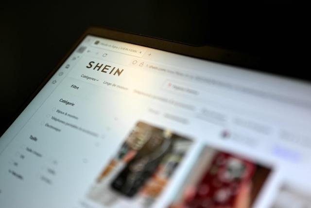 This photograph shows the Shein e-commerce website page on a computer in Paris on November 5, 2025. The Asian e-commerce giant Shein announced to AFP on November 5, 2025 that it is suspending its "marketplace" in France, meaning the products offered online by third-party sellers, after the scandal linked to the sale of sex dolls resembling little girls. Shein made this decision "following concerns related to certain listings made by independent third-party sellers," according to a company statement. A source close to the matter told AFP that this announcement is unrelated to the French government's decision to initiate proceedings to suspend the Shein platform in France. (Photo by Julie SEBADELHA / AFP)