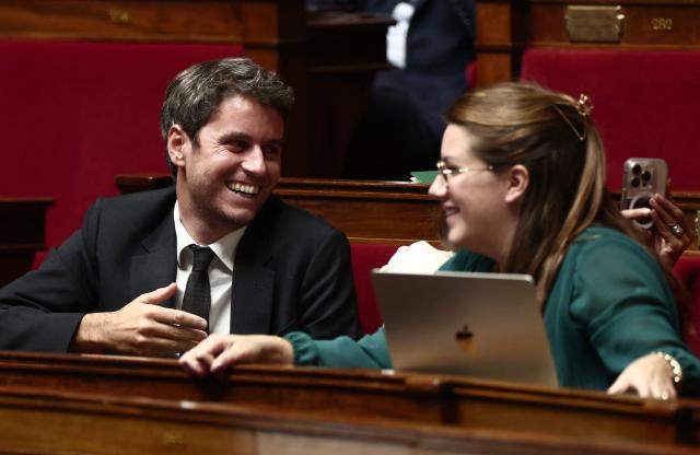 President of Ensemble Pour la Republique parliamentary group Gabriel Attal (L) and Ensemble Pour la Republique's MP Julie Delpech attend a session to discuss France's social security budget (PLFSS) for 2026, at the National Assembly, French Parliament lower house, in Paris on November 5, 2025. (Photo by Thibaud MORITZ / AFP)