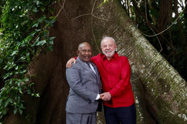Brazil’s President Luiz Inacio Lula da Silva (R) and Comoros President Azali Assoumani greet during a meeting in Belem, Para State, Brazil, on November 5, 2025. Lula da Silva is preparing to hots the COP30 UN climate summit next November 10 to 21, in Belem. (Photo by Tarso Sarraf / AFP)