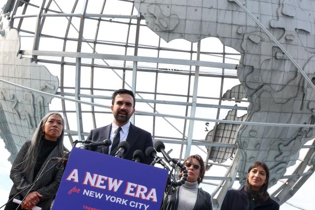 New York City mayor-elect Zohran Mamdani, alongside his mayoral transition team, speaks during a news coference at Flushing Meadows–Corona Park in the Queens borough of New York City on November 5, 2025. Mamdani, 34, is the city's first Muslim mayor and the youngest to serve in more than a century. The Democratic socialist's victory came in the face of fierce attacks on his policies and his Muslim heritage from business elites, conservative media commentators and Trump himself. (Photo by TIMOTHY A.CLARY / AFP)