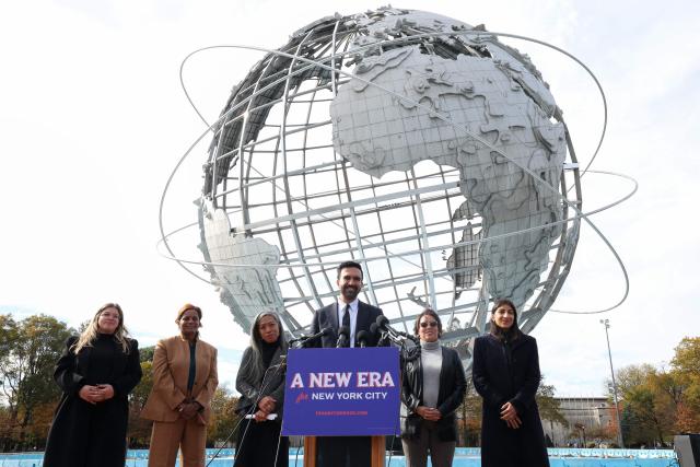 New York City mayor-elect Zohran Mamdani, alongside his mayoral transition team, speaks during a news coference at Flushing Meadows–Corona Park in the Queens borough of New York City on November 5, 2025. Mamdani, 34, is the city's first Muslim mayor and the youngest to serve in more than a century. The Democratic socialist's victory came in the face of fierce attacks on his policies and his Muslim heritage from business elites, conservative media commentators and Trump himself. (Photo by TIMOTHY A.CLARY / AFP)