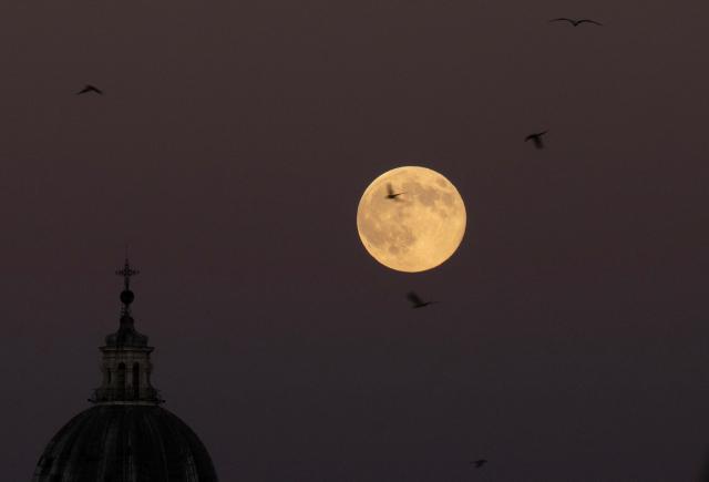 A supermoon, also called Beaver Moon, rises in the sky of Rome on November 5, 2025. (Photo by Tiziana FABI / AFP)