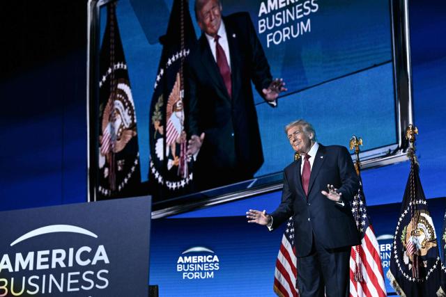 US President Donald Trump gestures as he arrives to speak at the American Business Forum at the Kaseya Center in Miami on November 5, 2025. (Photo by Brendan SMIALOWSKI / AFP)