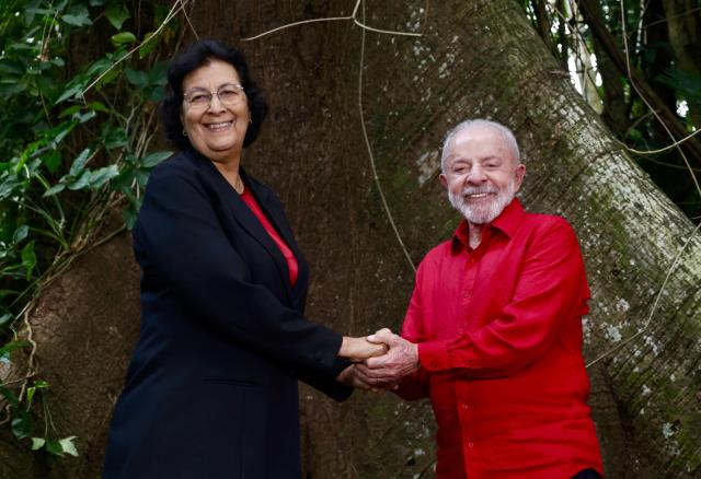 Brazil's President Luiz Inacio Lula da Silva (R) and Suriname's President Jennifer Geerlings-Simons greet during a meeting in Belem, Para State, Brazil, on November 5, 2025. Lula da Silva is preparing to host the COP30 UN climate summit next November 10 to 21, in Belem. (Photo by Tarso Sarraf / AFP)