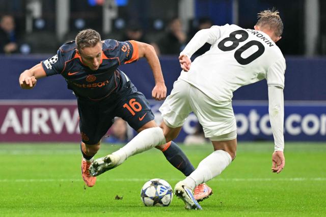 Inter Milan's Italian midfielder #16 Davide Frattesi fights for the ball with Kairat Almaty's Russian defender #80 Egor Sorokin during the UEFA Champions League phase day 4 football match between Inter Milan and Kairat Almaty at San Siro stadium in Milan, on November 5, 2025. (Photo by Stefano RELLANDINI / AFP)