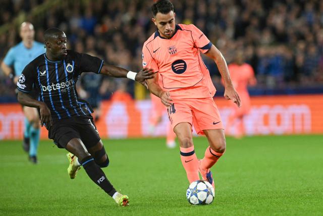Club Brugge's Portuguese forward #09 Carlos Forbs (L) fights for the ball with Barcelona's Spanish defender #24 Eric Garcia during the UEFA Champions League league phase day 4 football match between Club Brugge and FC Barcelona at Jan Breydelstadion stadium, in Bruges, on November 5, 2025. (Photo by NICOLAS TUCAT / AFP)