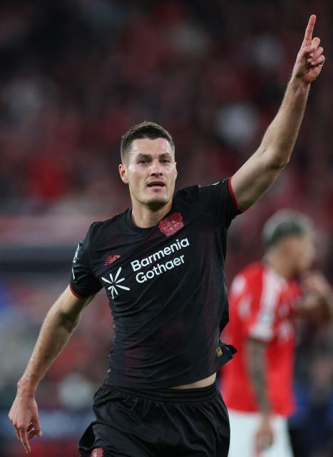 Bayer Leverkusen's Czech forward #14 Patrik Schick celebrates scoring the opening goal during the UEFA Champions League league phase day 4 football match between SL Benfica and Bayer Leverkusen at Estadio da Luz in Lisbon on November 5, 2025. (Photo by PATRICIA DE MELO MOREIRA / AFP)