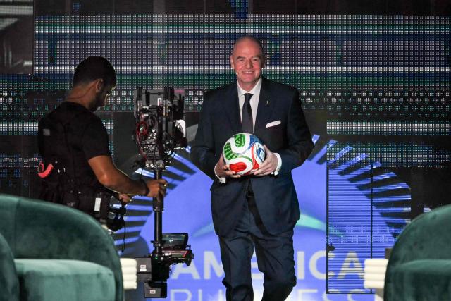 FIFA President Gianni Infantino goes up on the stage to speak at the American Business Forum at the Kaseya Center in Miami on November 5, 2025. (Photo by Chandan Khanna / AFP)
